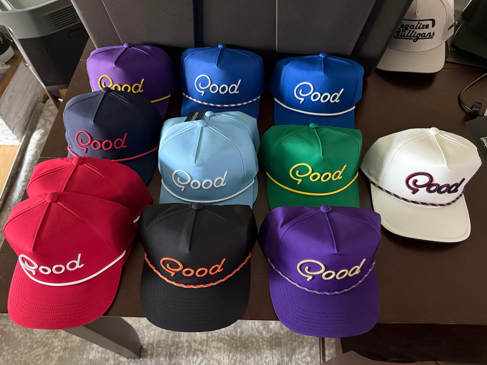 Good Good rope-brim golf hats laid out in a range of colors