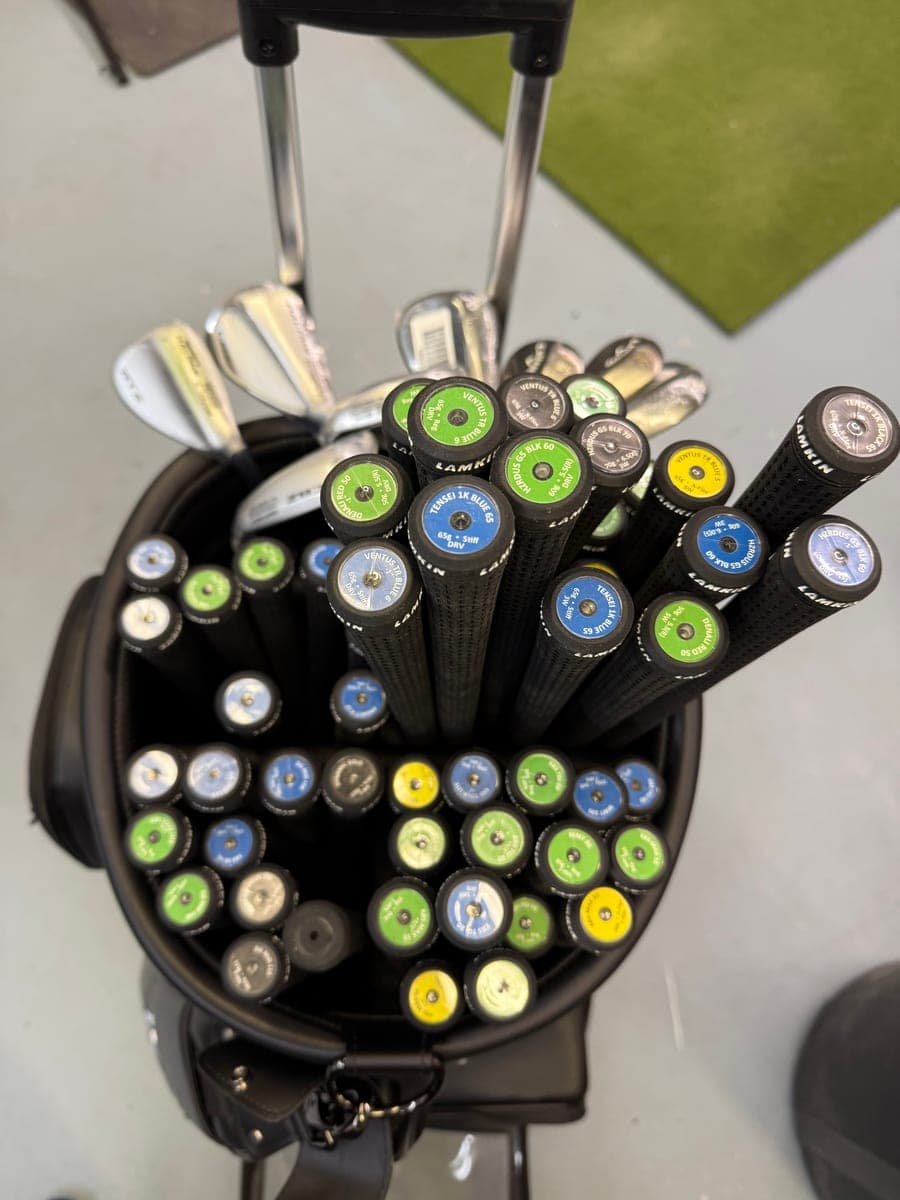Top-down view of fitting shafts and grips organized in a bag