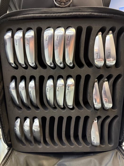 Set of 7-irons organized in a fitting travel case